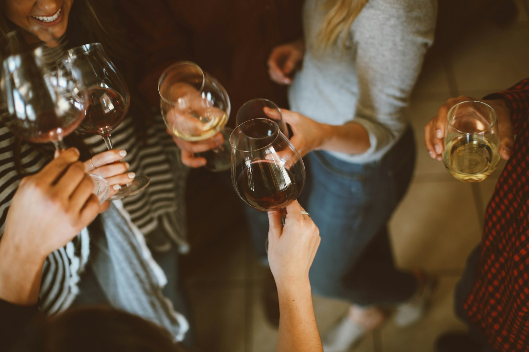 Guests raising glasses together at an evening reception