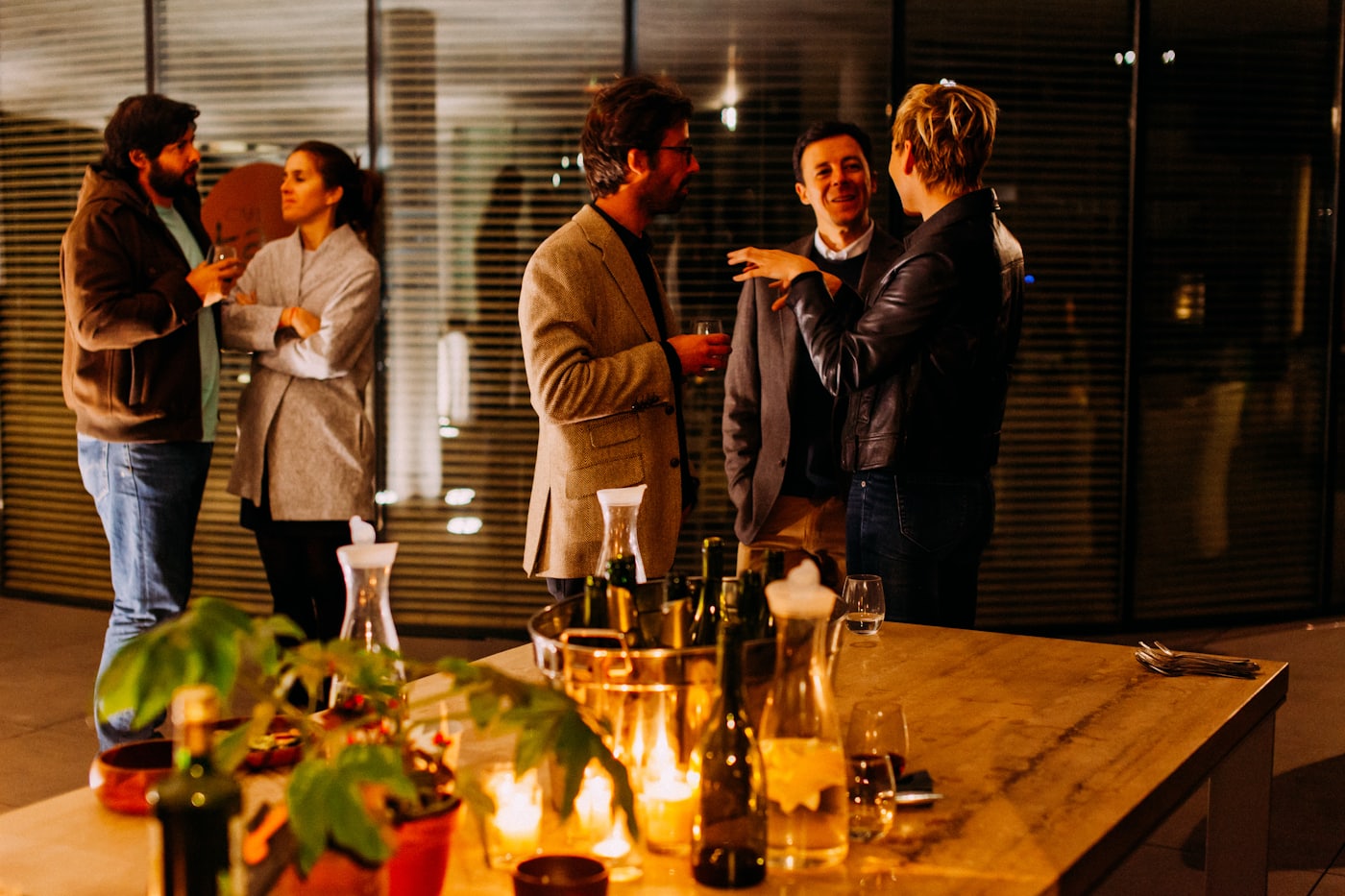 Guests with drinks at an evening client reception
